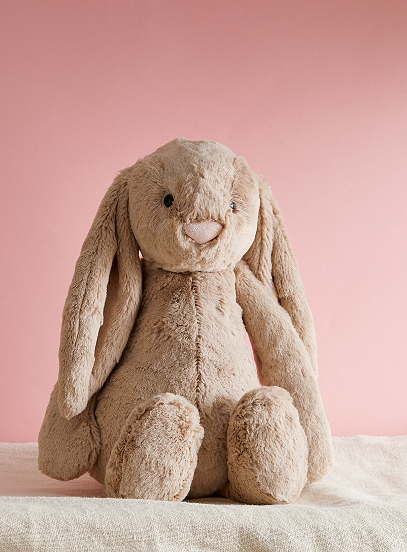 pinky bunny on bed image