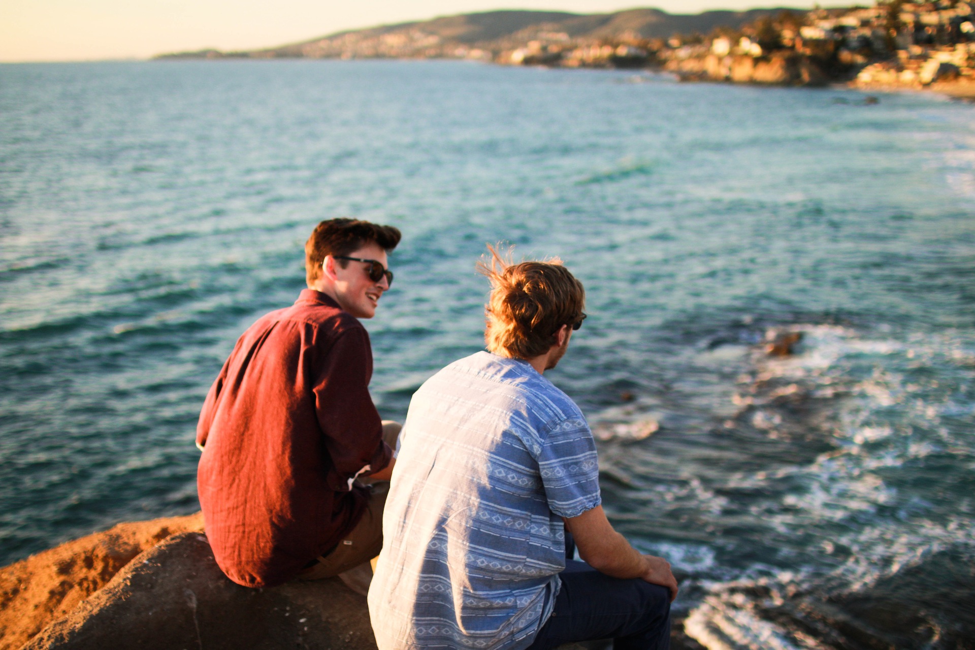 two guys talking on the coast