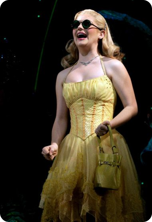 Glinda in a yellow dress