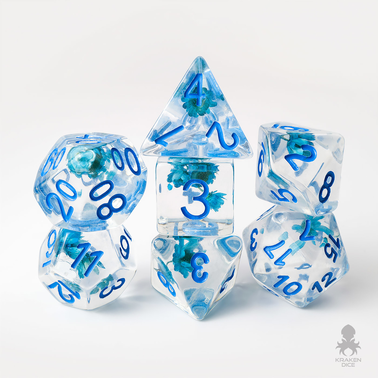DND dice that are transparent with small blue flowers inside.
