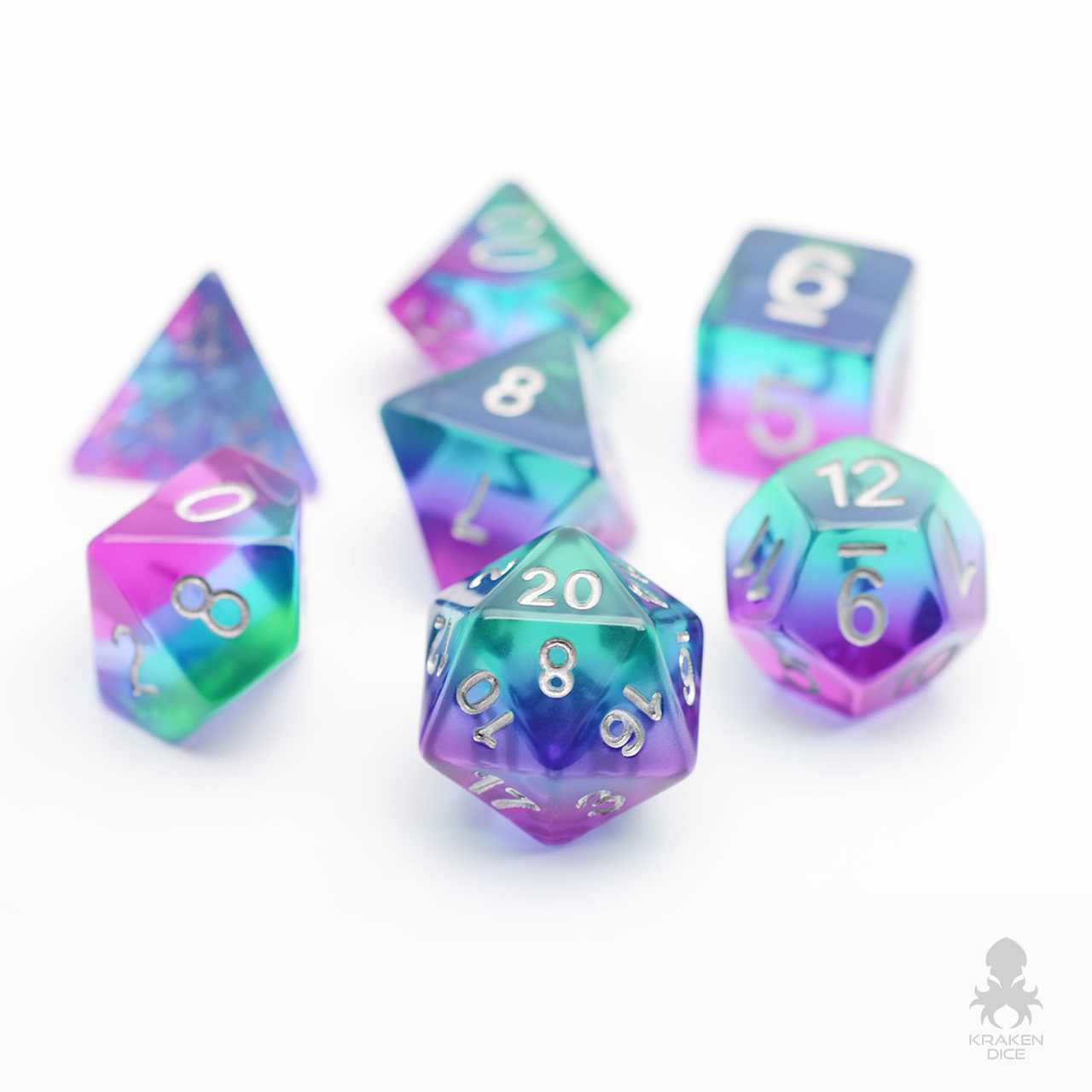 DND dice that are pink, blue and purple and semi-transparent.