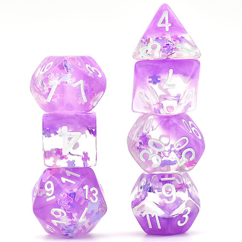 DND dice that are purple and semi-transparent with small glittery puzzle pieces inside.